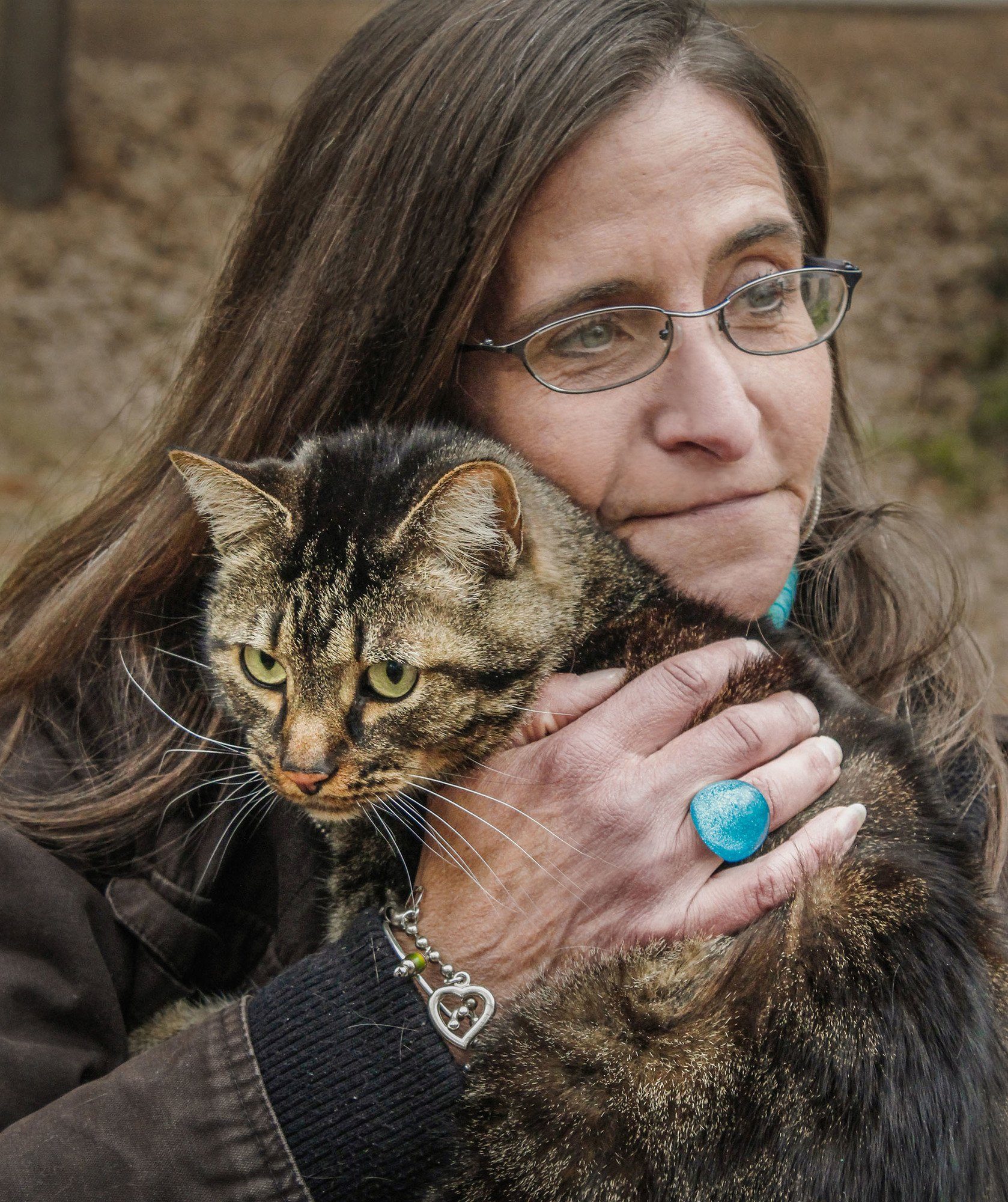 senior woman holding cat